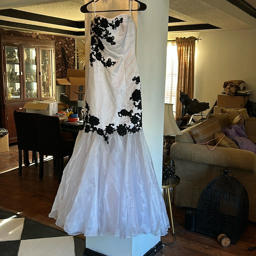 This dress was worn in once to prom. It was especially made . Dress is a Jovani